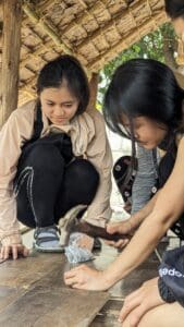 Victory students build a hut